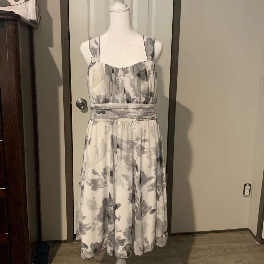 White and black Dress with straps .